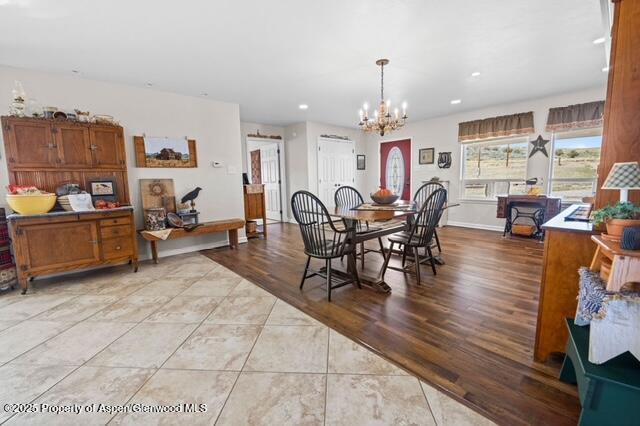 1040 Pronghorn Road Craig, CO 81625 - Photo 22 of 70 a view of a dining room with furniture window and wooden floor