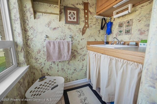 1040 Pronghorn Road Craig, CO 81625 - Photo 35 of 70 a bathroom with a sink a toilet and shower