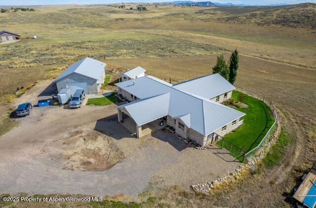 1040 Pronghorn Road Craig, CO 81625 - Photo 4 of 70 an aerial view of a house with outdoor space