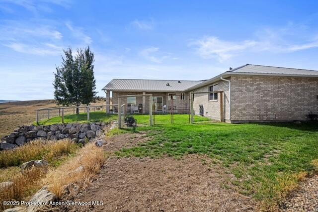 1040 Pronghorn Road Craig, CO 81625 - Photo 60 of 70 a view of a house with a yard