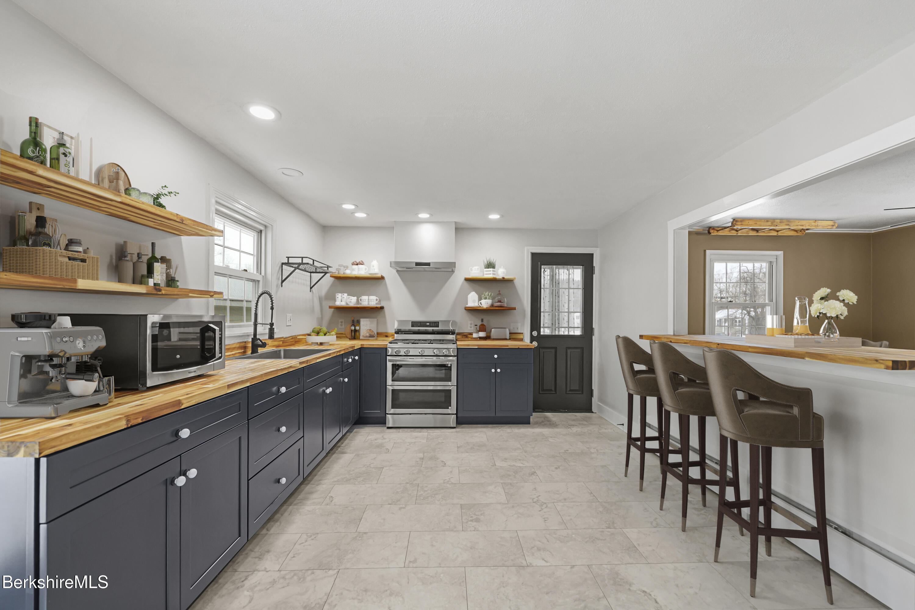 290 East Center Street Lee, MA 01238 - Photo 14 of 47 a kitchen with stainless steel appliances granite countertop a sink counter space and cabinets