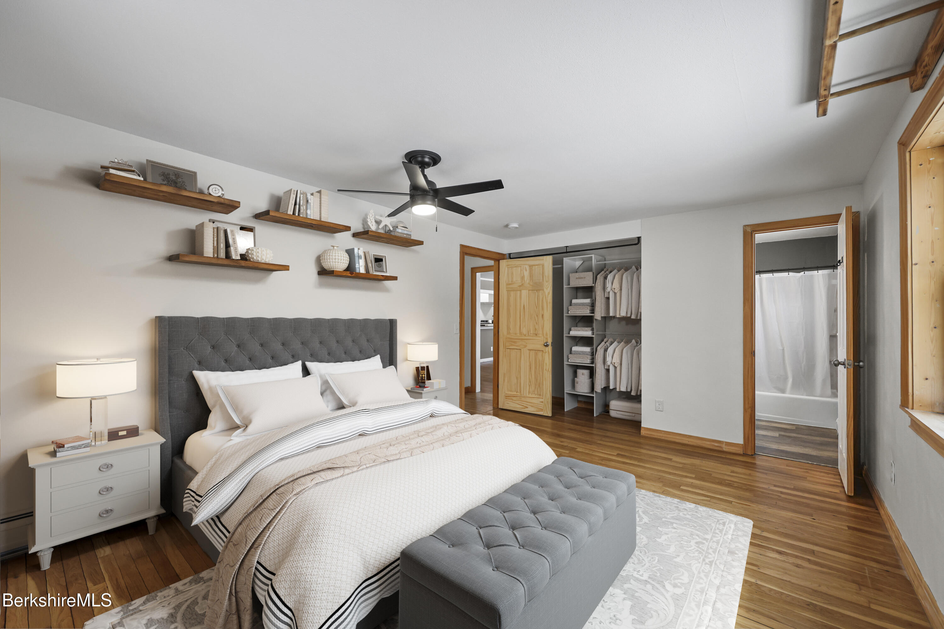 290 East Center Street Lee, MA 01238 - Photo 26 of 47 a bedroom with a bed and wooden floor