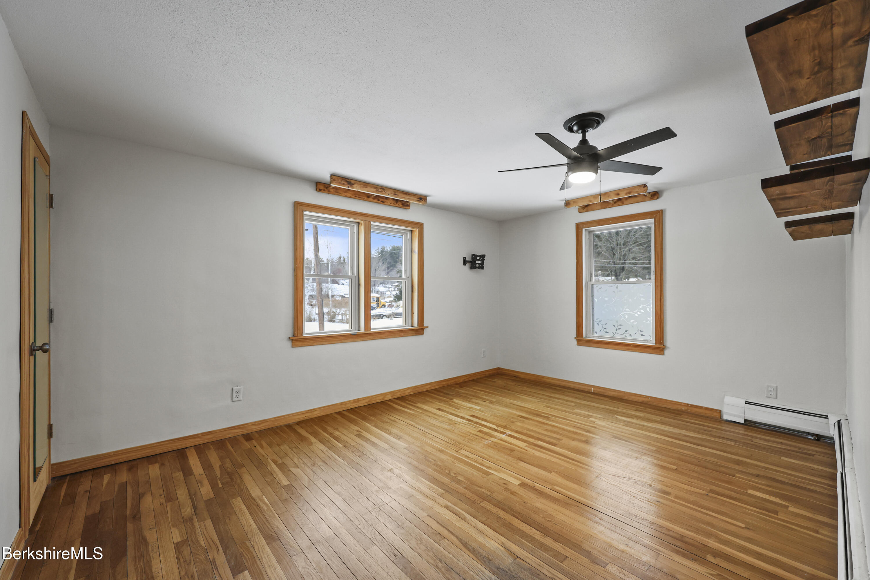 290 East Center Street Lee, MA 01238 - Photo 27 of 47 a view of empty room with wooden floor and fan