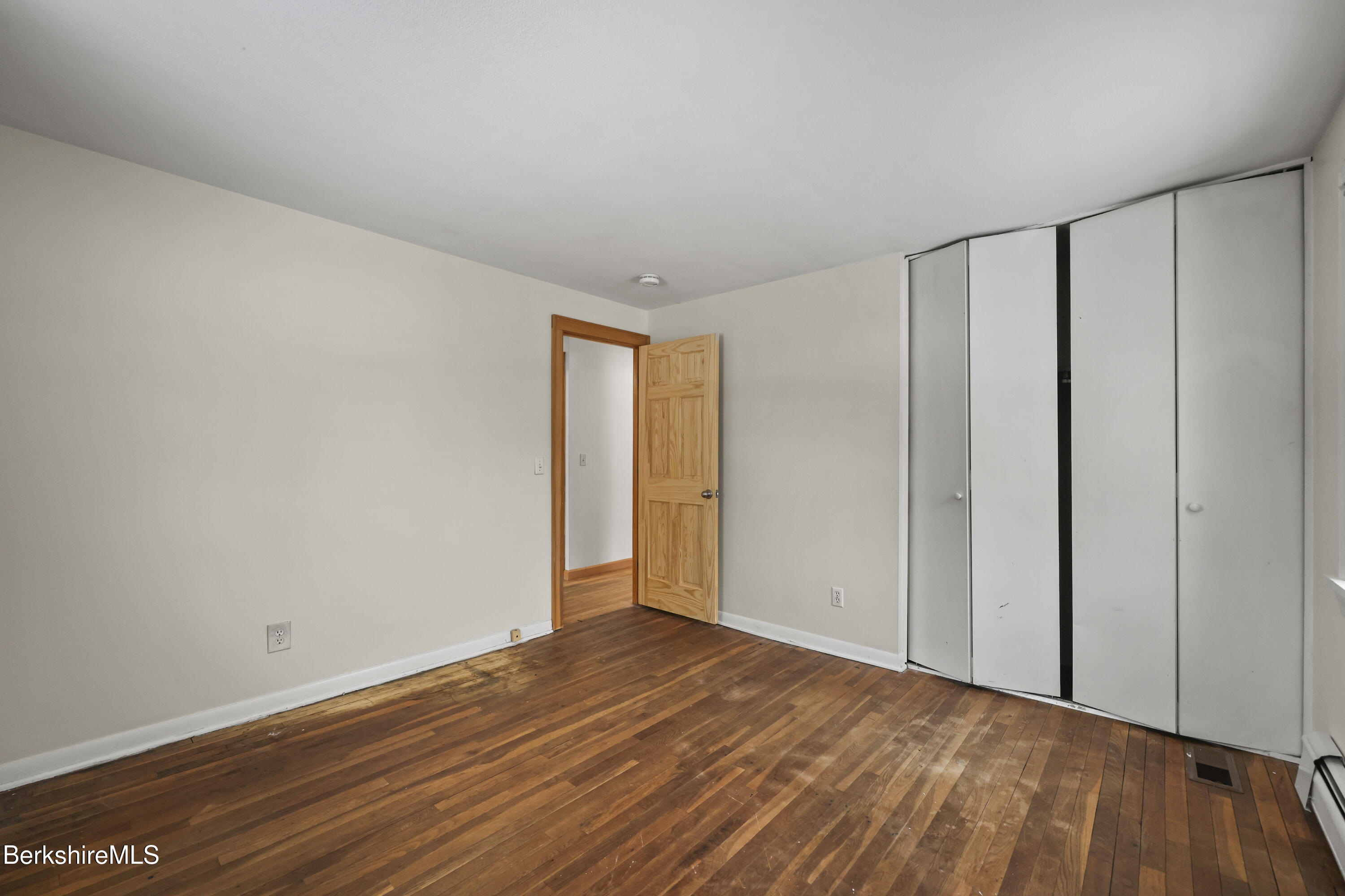 290 East Center Street Lee, MA 01238 - Photo 32 of 47 a view of an empty room with wooden floor
