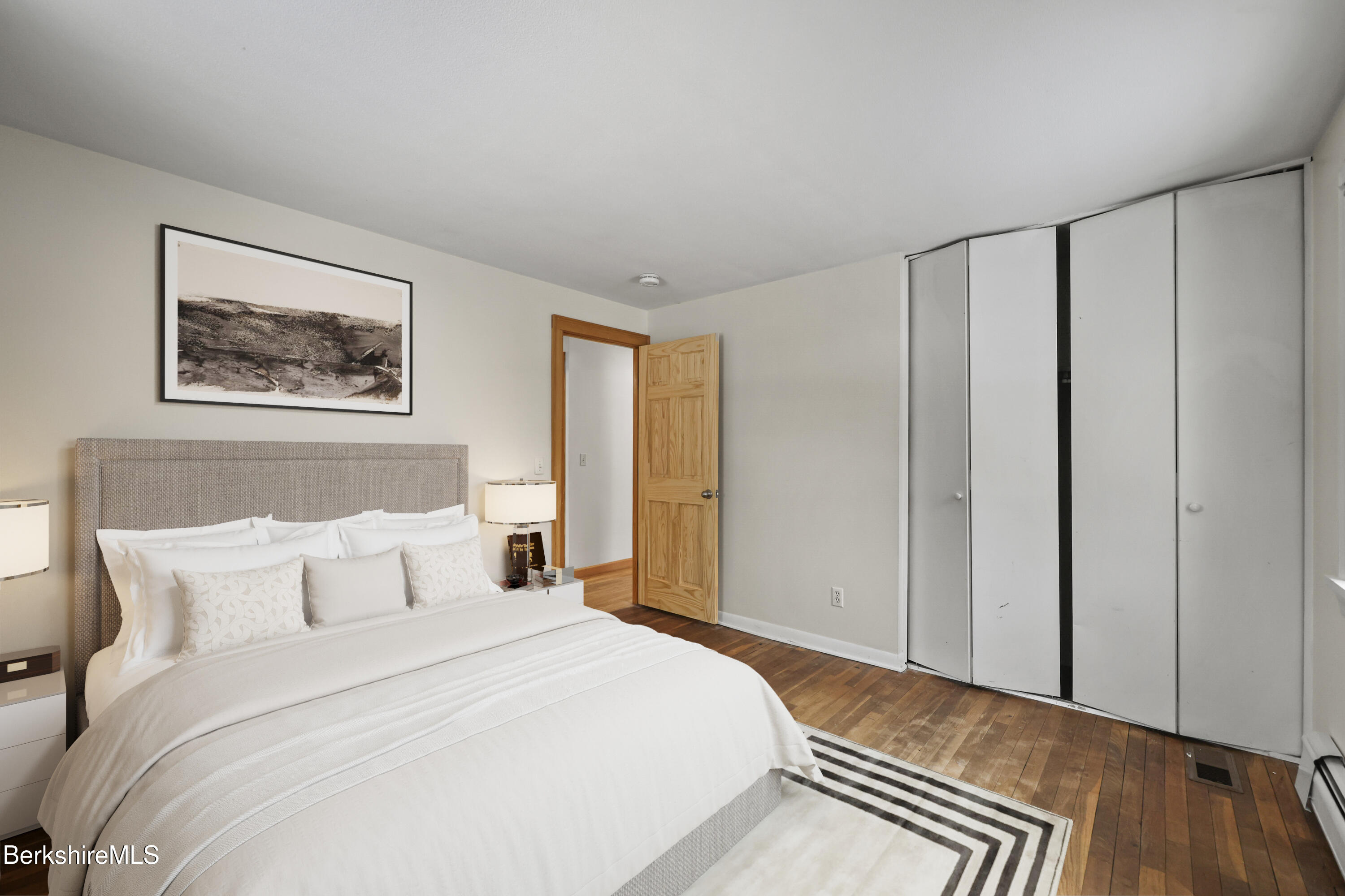 290 East Center Street Lee, MA 01238 - Photo 33 of 47 a bedroom with a bed and a painting on the wall