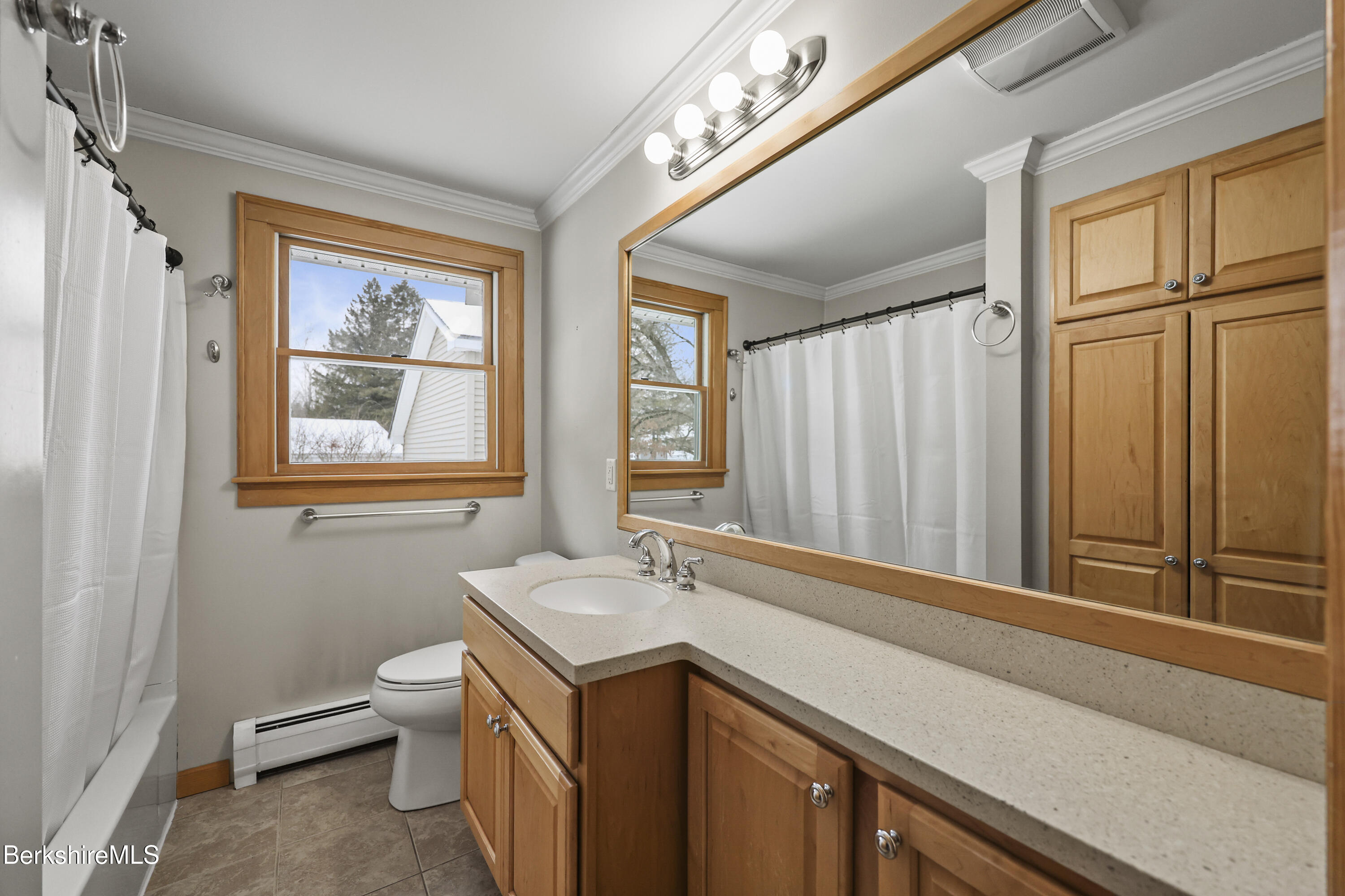 290 East Center Street Lee, MA 01238 - Photo 35 of 47 a bathroom with a sink a toilet and a window