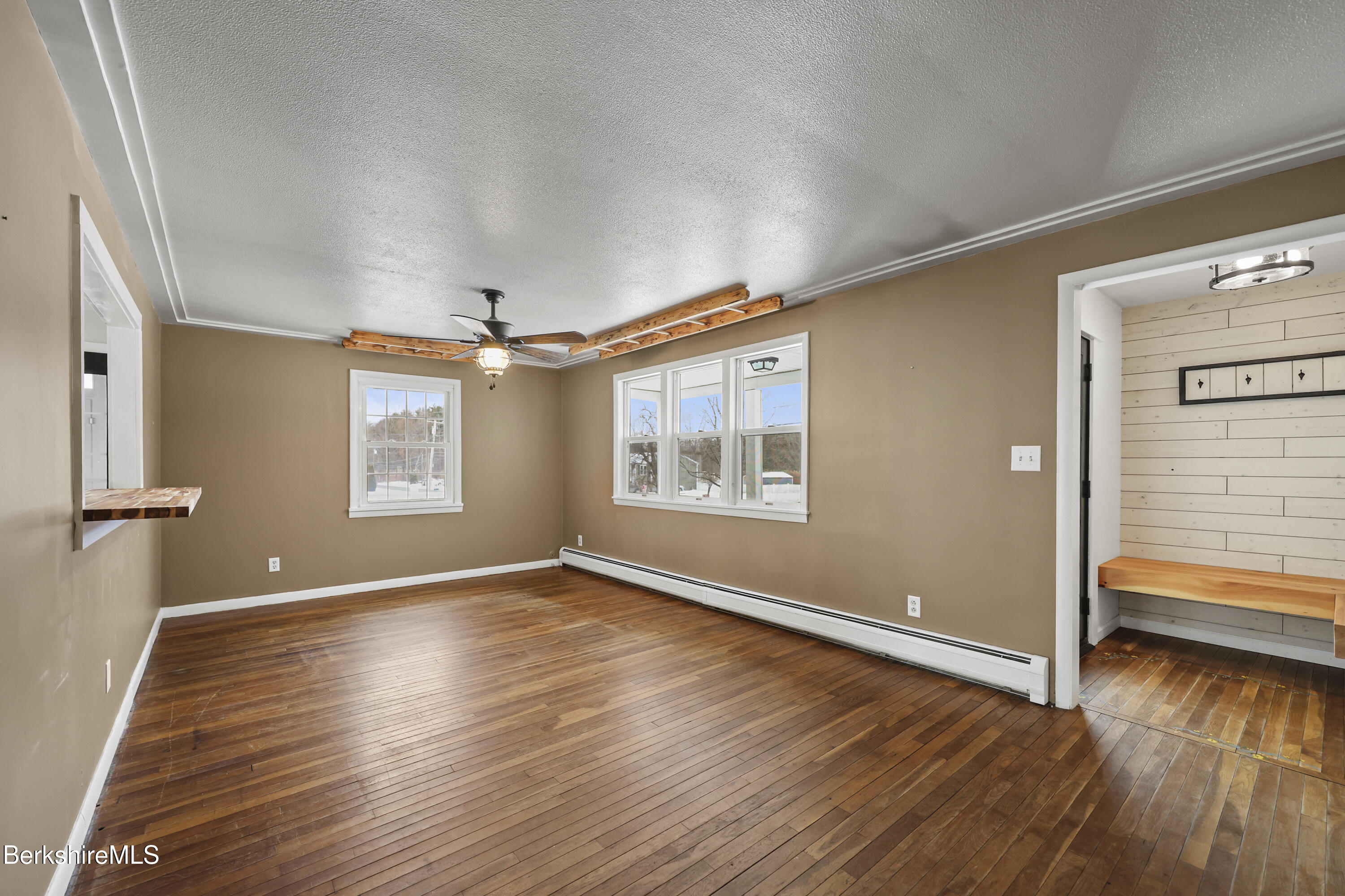 290 East Center Street Lee, MA 01238 - Photo 9 of 47 wooden floor in an empty room with a window
