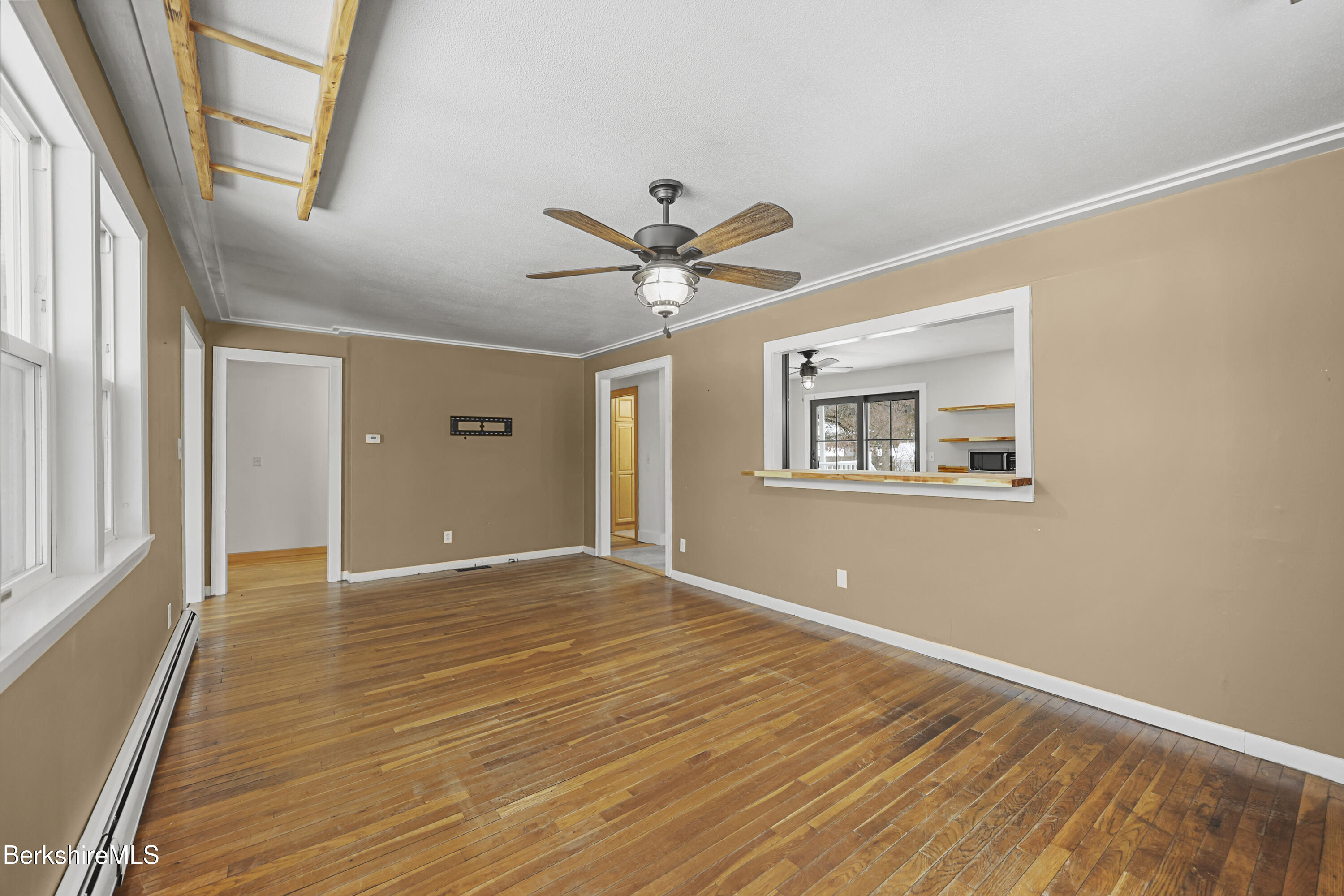 290 East Center Street Lee, MA 01238 - Photo 10 of 47 a view of an empty room with window and wooden floor