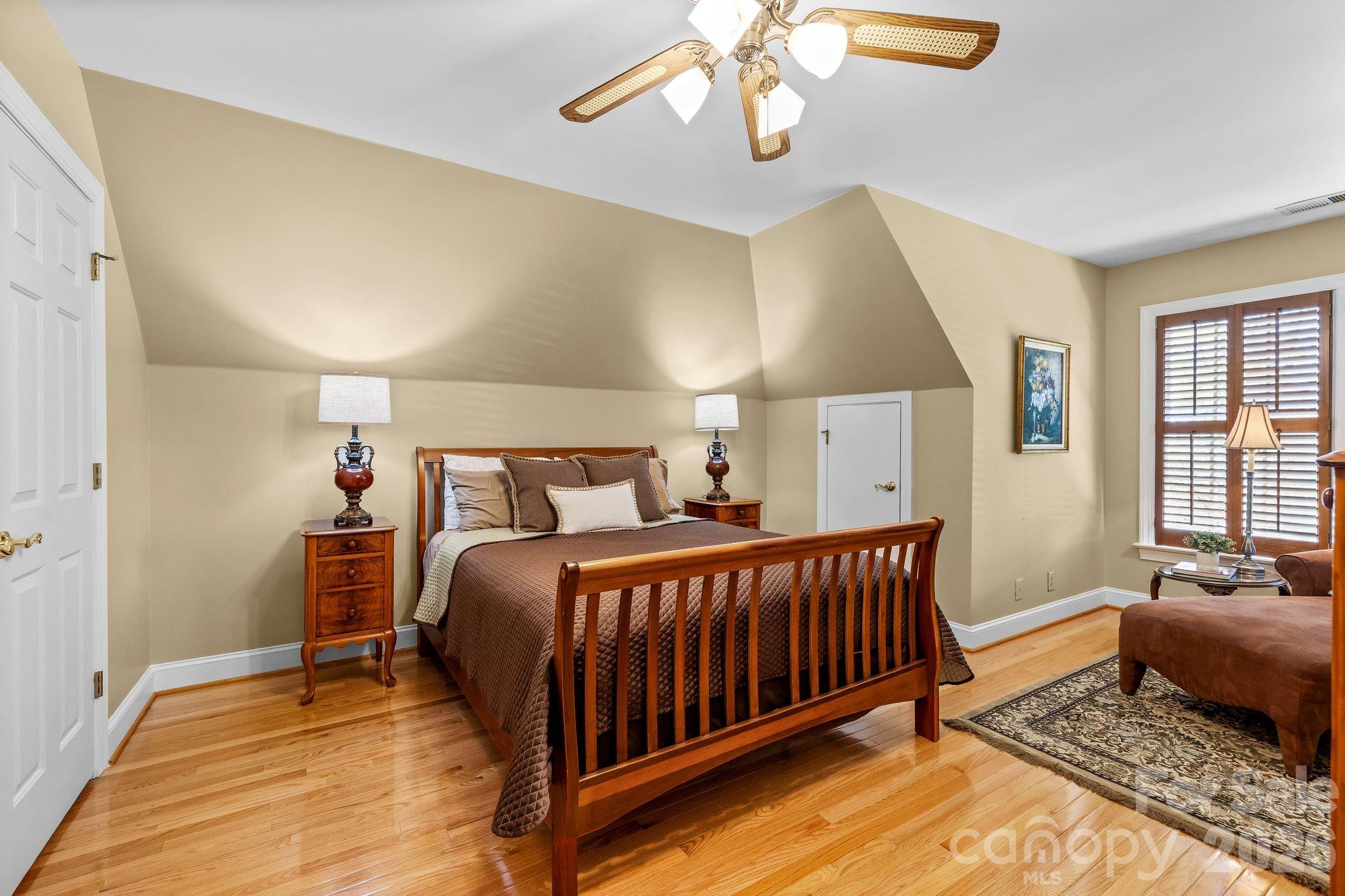 3530 Cardiff Lane Matthews, NC 28104 - Photo 30 of 39 a bed room with a bed and a couch