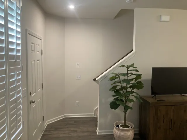 a vase of flowers sitting on a table in a room
