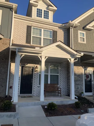 a front view of a house with yard