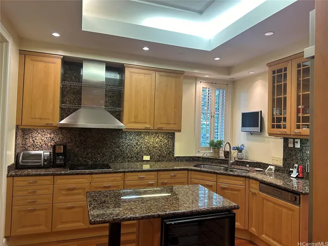 a kitchen with stainless steel appliances granite countertop a sink stove and cabinets