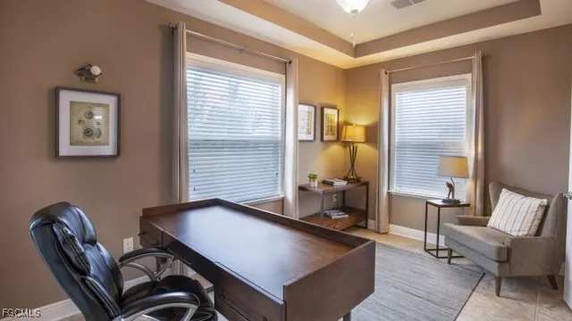 a room with chairs and a large window