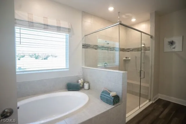 a bathroom with a bathtub and a shower