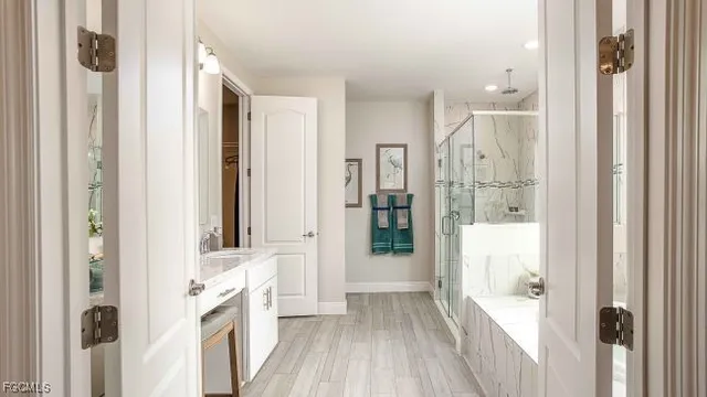 a bathroom with a bathtub and a shower
