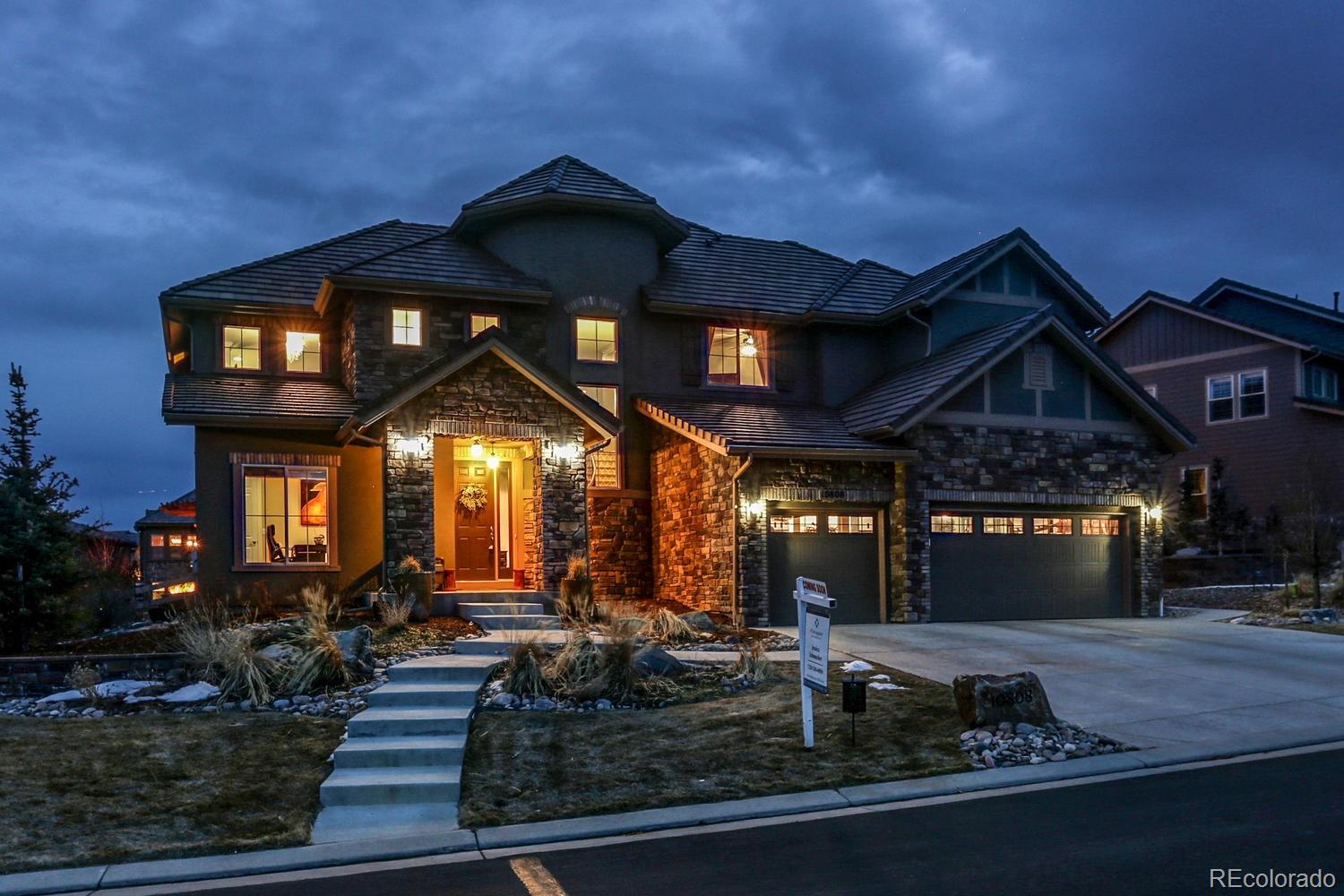 10808 Sundial Rim Road Highlands Ranch, CO 80126 - Photo 1 of 26 a view of a building with a pathway