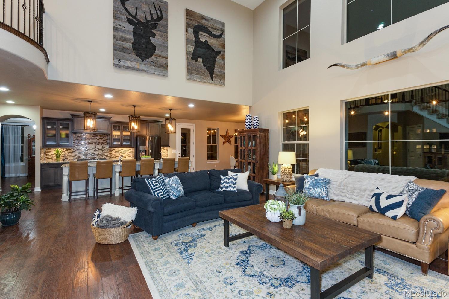 10808 Sundial Rim Road Highlands Ranch, CO 80126 - Photo 20 of 26 a living room with furniture and a large window