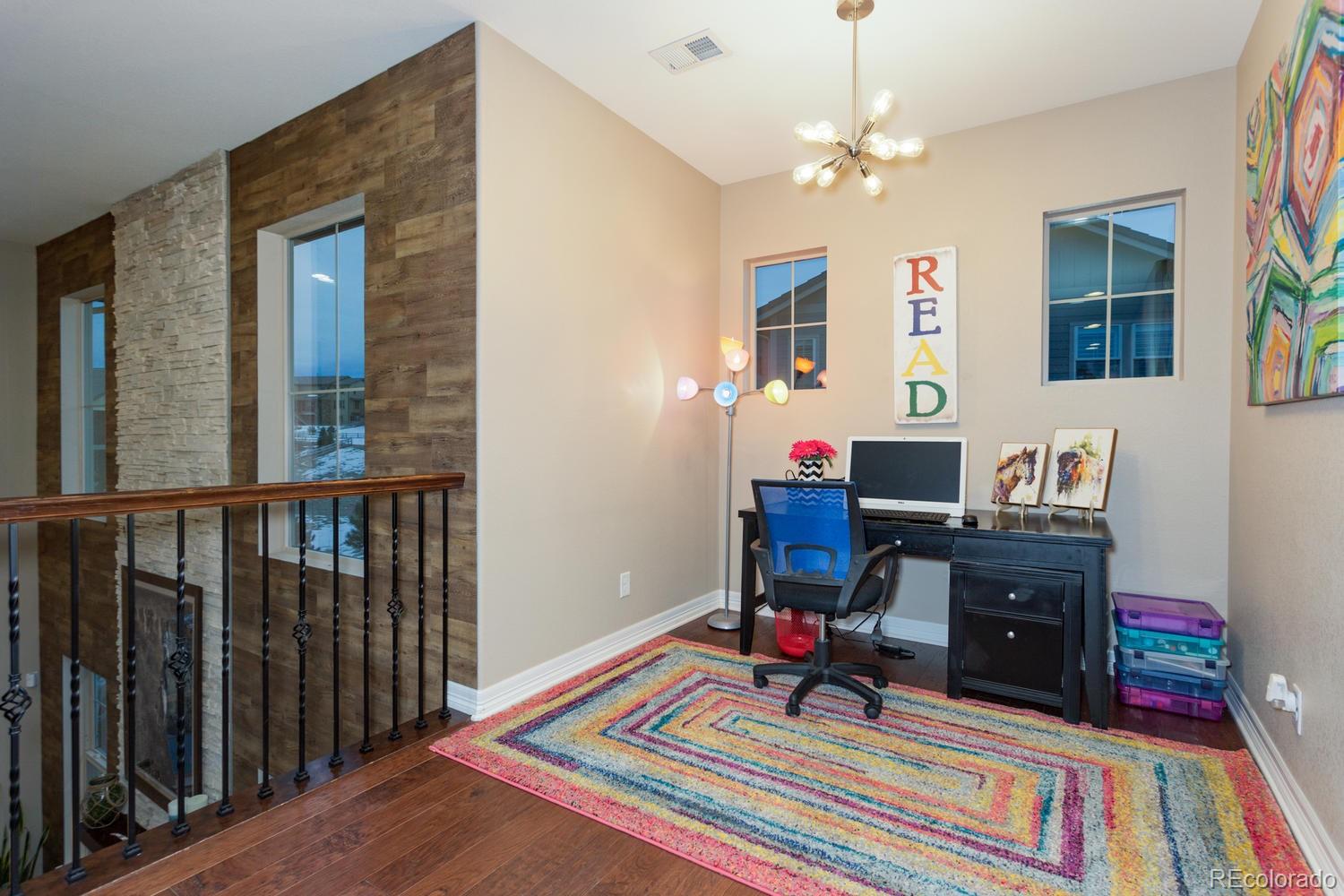 10808 Sundial Rim Road Highlands Ranch, CO 80126 - Photo 23 of 26 a workspace with furniture and a rug