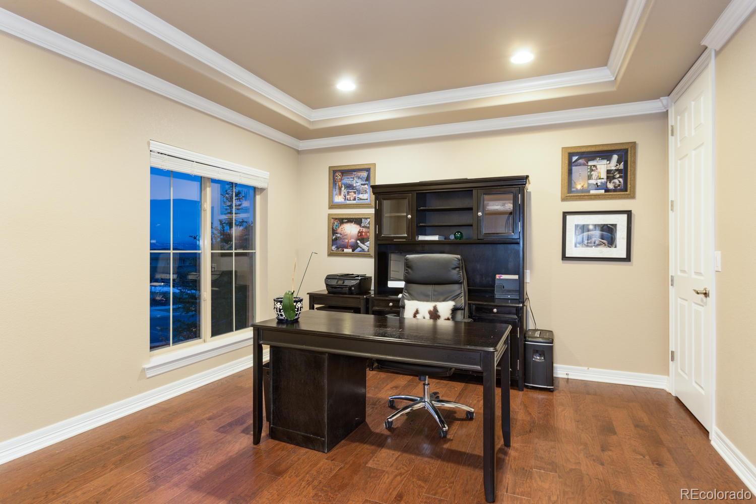 10808 Sundial Rim Road Highlands Ranch, CO 80126 - Photo 24 of 26 a workspace with furniture and window