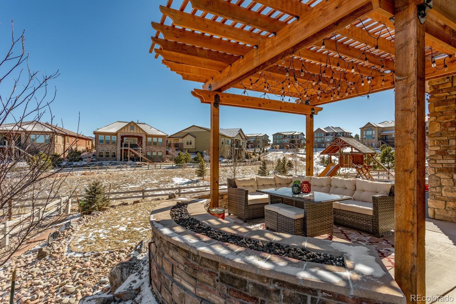 10808 Sundial Rim Road Highlands Ranch, CO 80126 - Photo 4 of 26 a view of a chairs and table in the patio