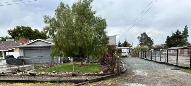 a view of a wrought iron fences in front of house