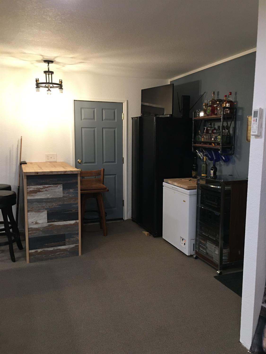 955 Elma Street Hickman, CA 95323 - Photo 7 of 27 a kitchen with refrigerator and cabinets
