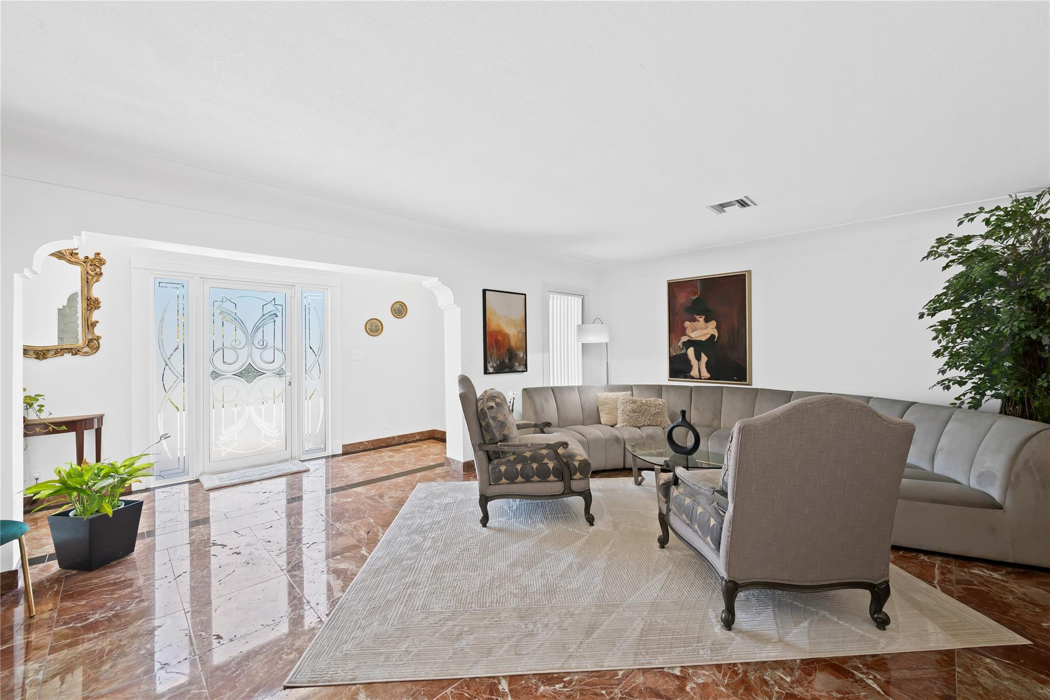 3301 Northeast 27th Avenue Lighthouse Point, FL 33064 - Photo 12 of 41 a living room with furniture and flowers