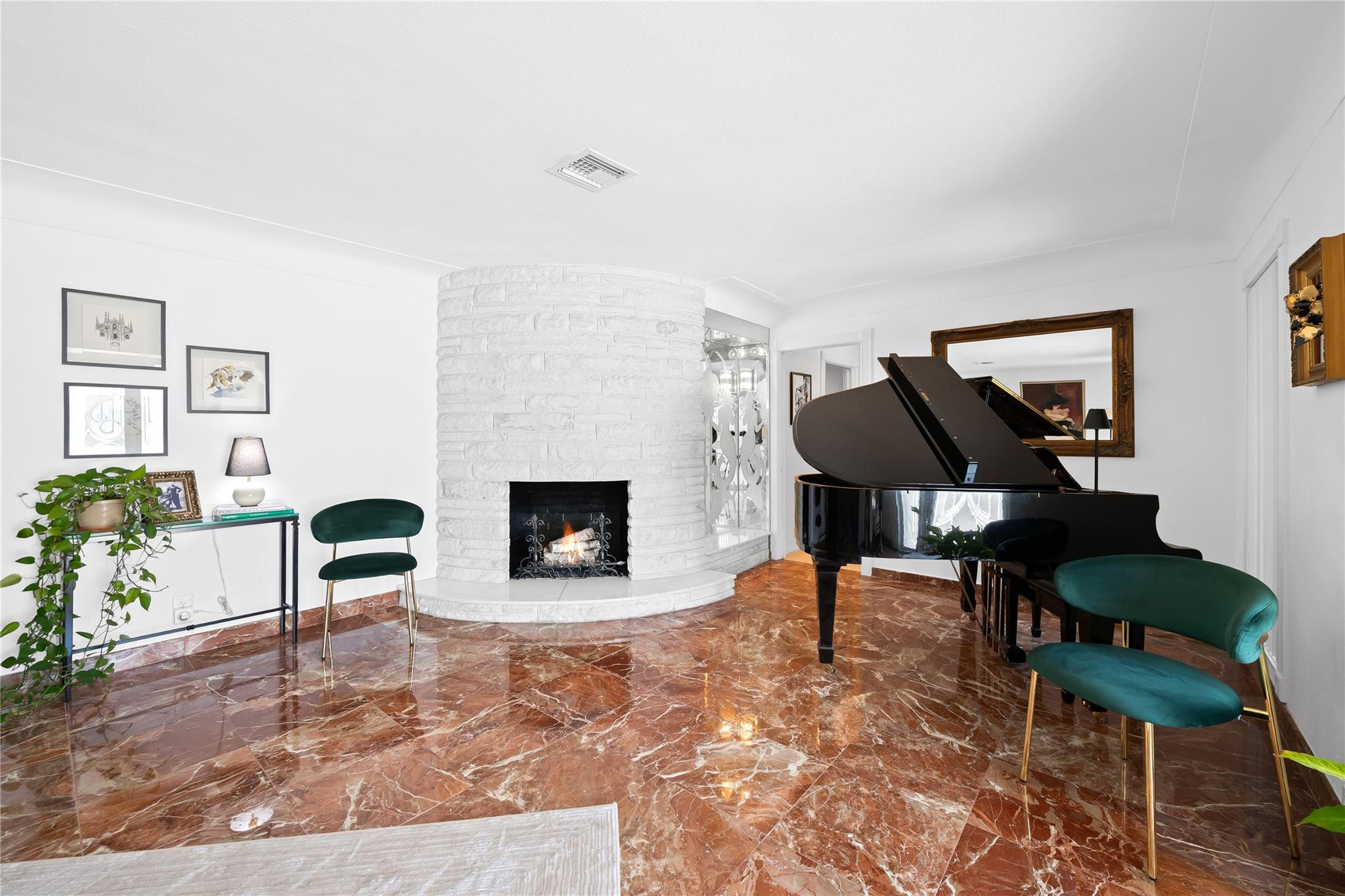 3301 Northeast 27th Avenue Lighthouse Point, FL 33064 - Photo 14 of 41 a living room with furniture and a fireplace