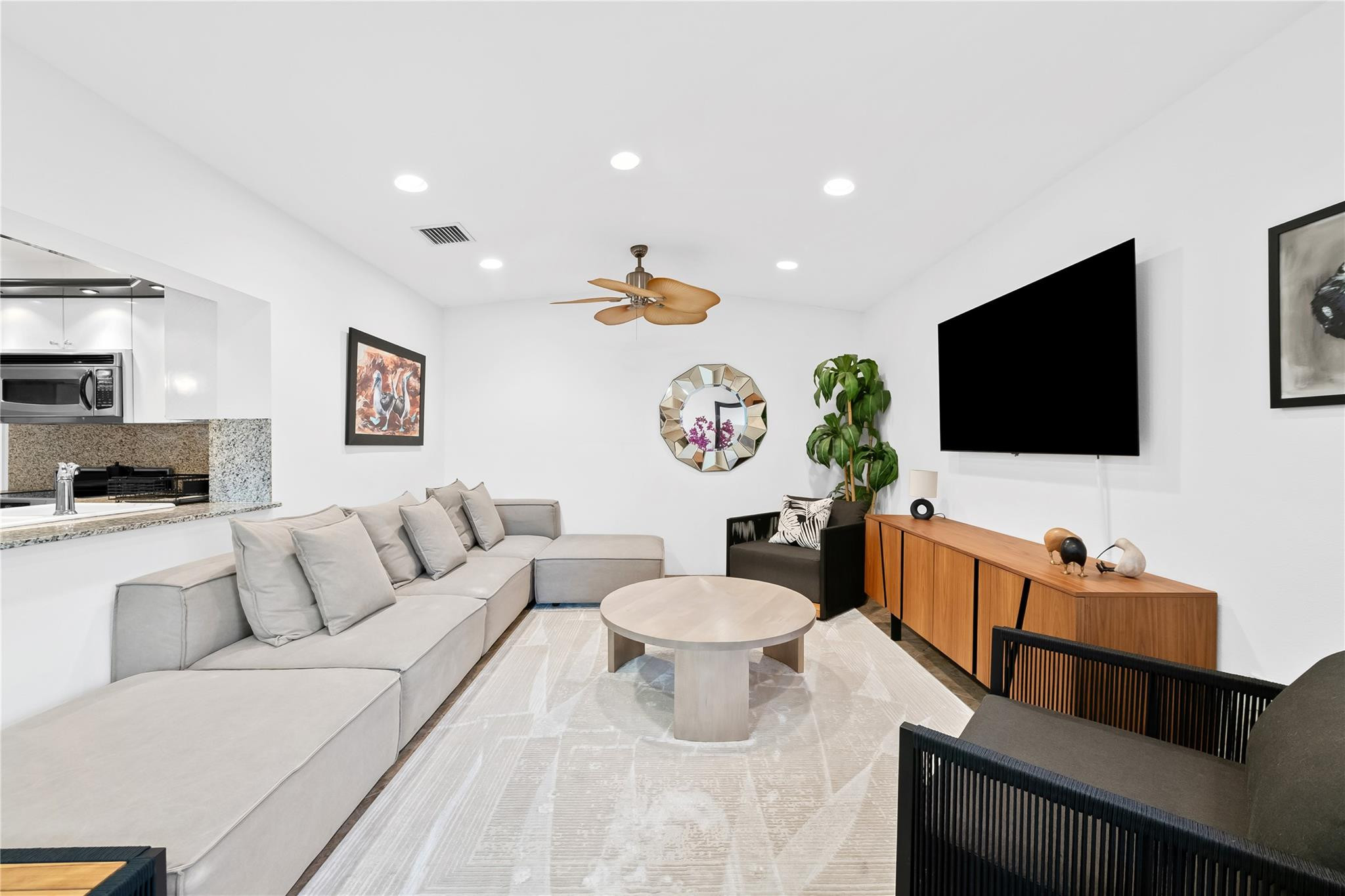 3301 Northeast 27th Avenue Lighthouse Point, FL 33064 - Photo 19 of 41 a living room with furniture and a flat screen tv