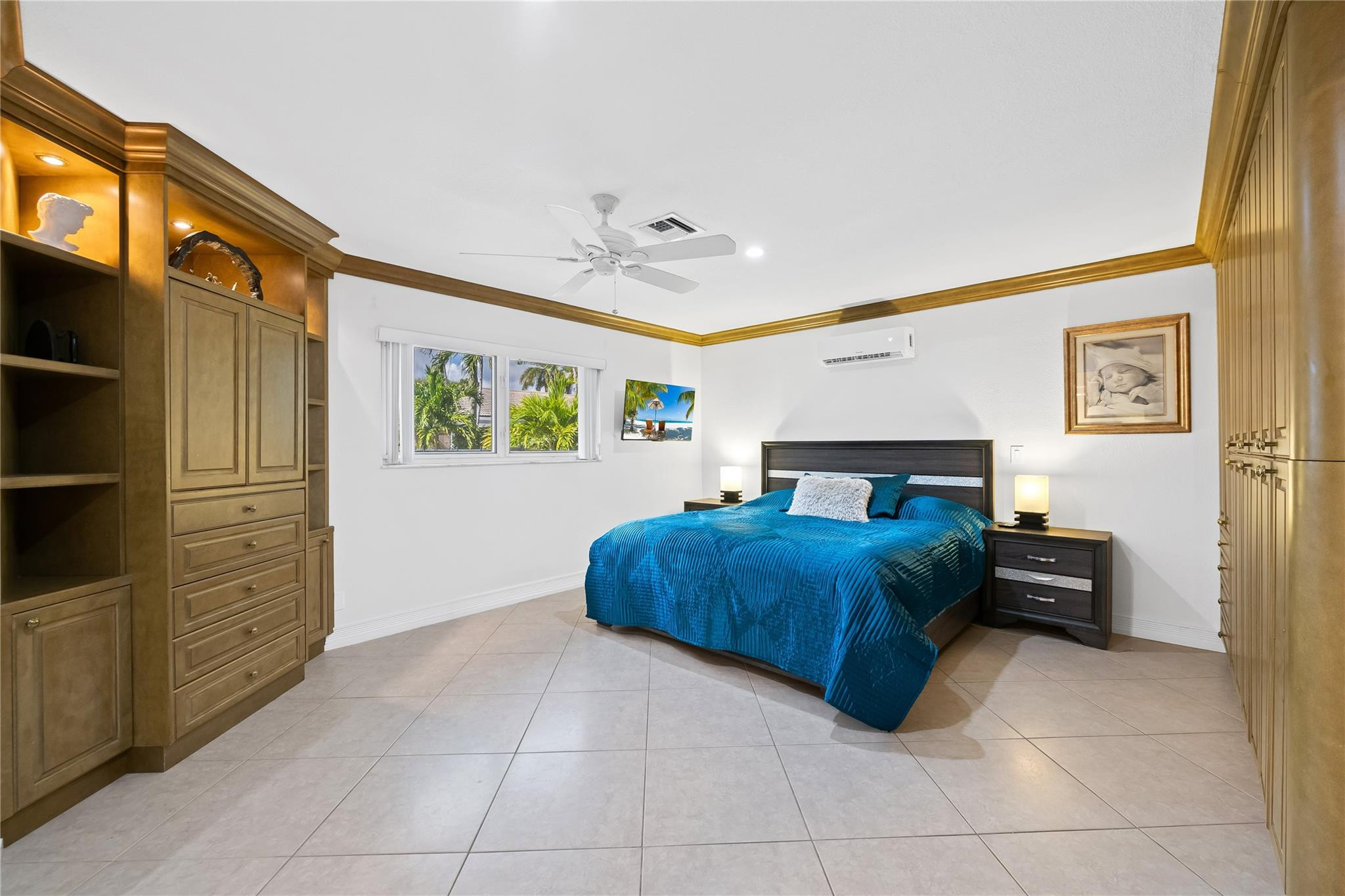 3301 Northeast 27th Avenue Lighthouse Point, FL 33064 - Photo 25 of 41 a spacious bedroom with a bed and a cabinets