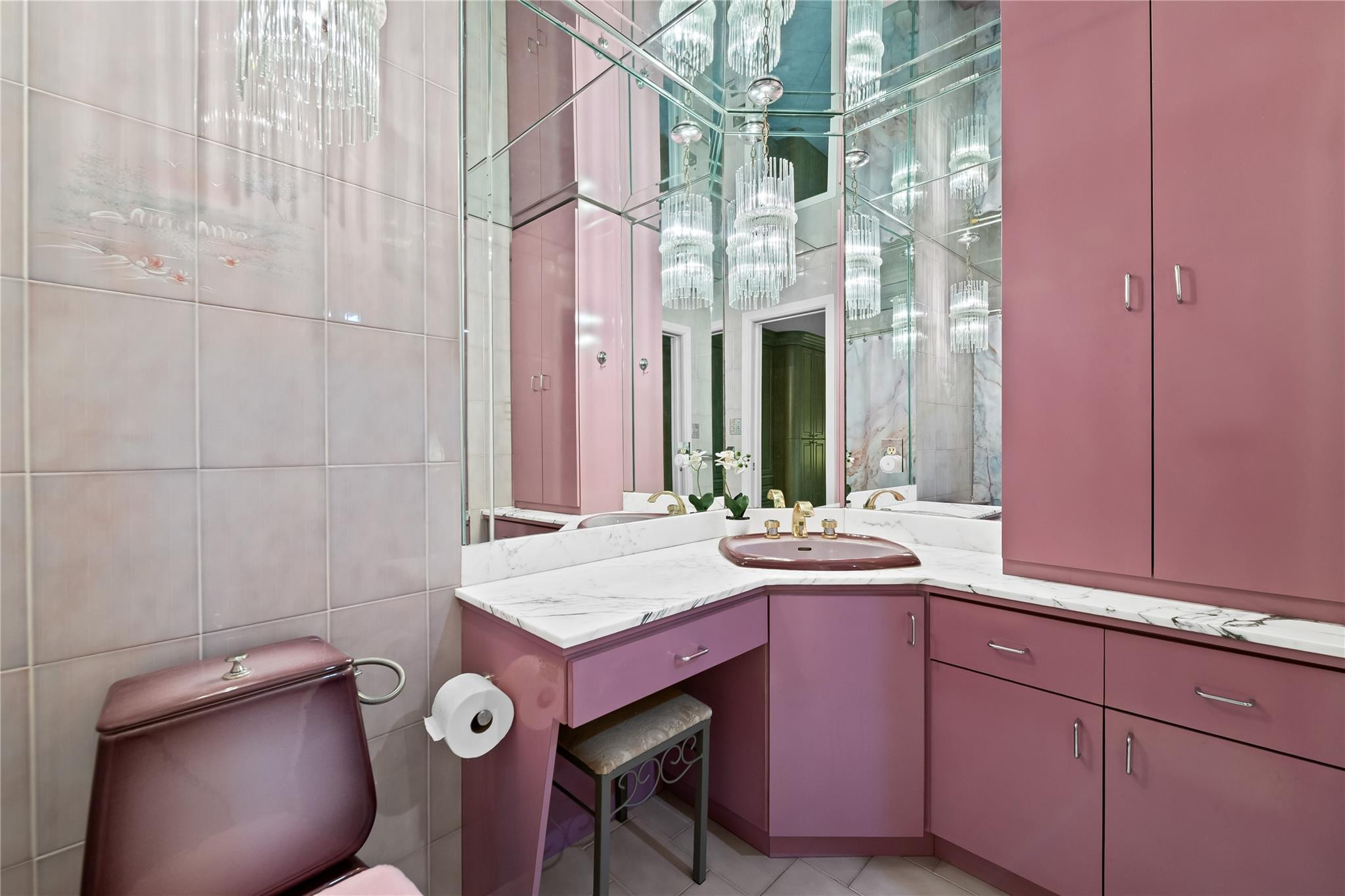 3301 Northeast 27th Avenue Lighthouse Point, FL 33064 - Photo 28 of 41 a bathroom with a sink and mirror with toilet