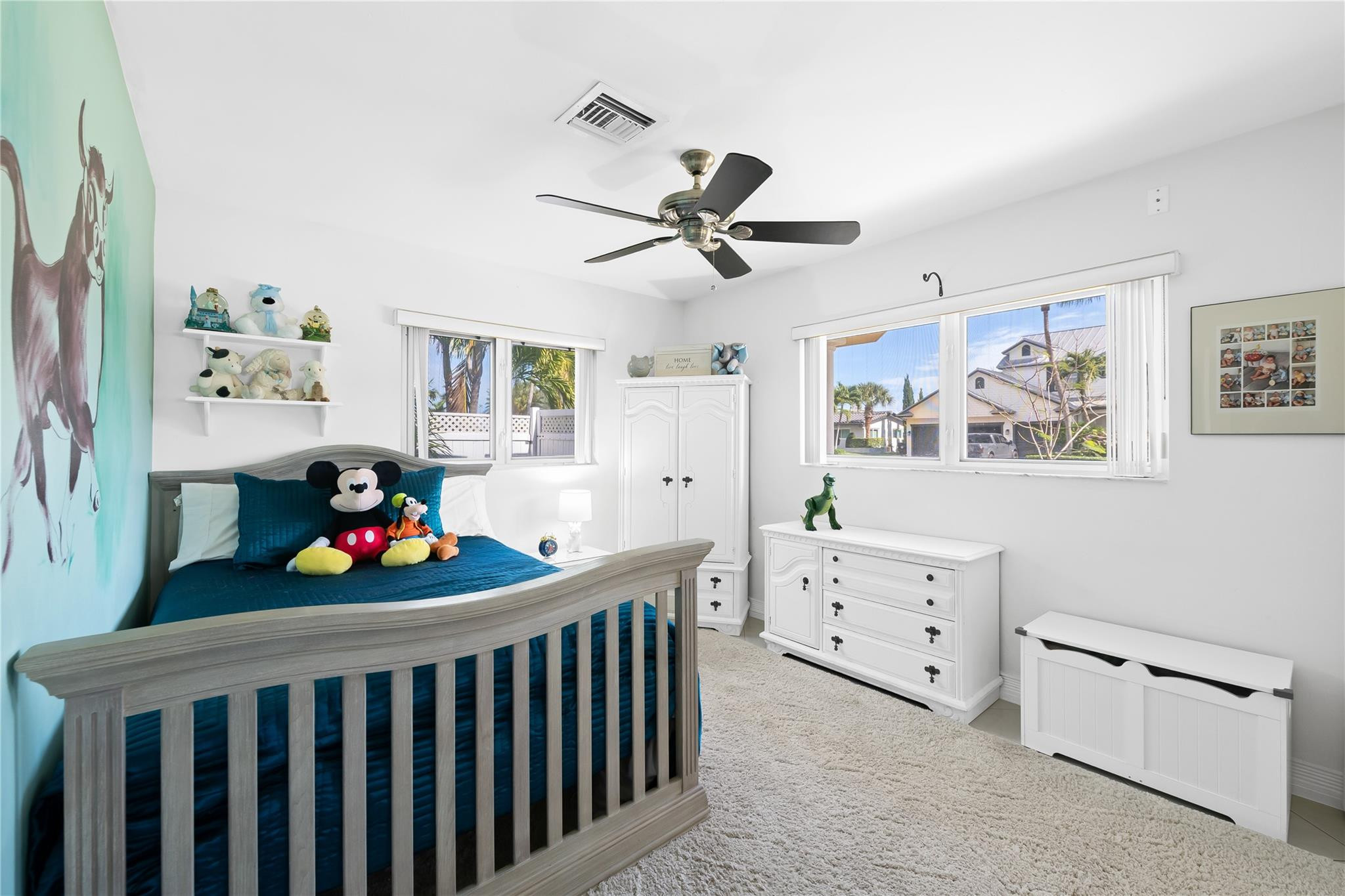 3301 Northeast 27th Avenue Lighthouse Point, FL 33064 - Photo 30 of 41 a room with baby crib and lots of furniture