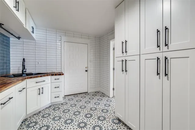 a hallway with cabinets