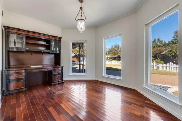 a kitchen with stainless steel appliances a stove and a large window