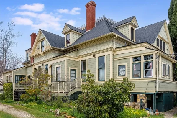 a living room with furniture a rug and a window
