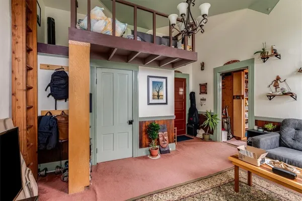 a view of a kitchen with granite countertop a sink and a window