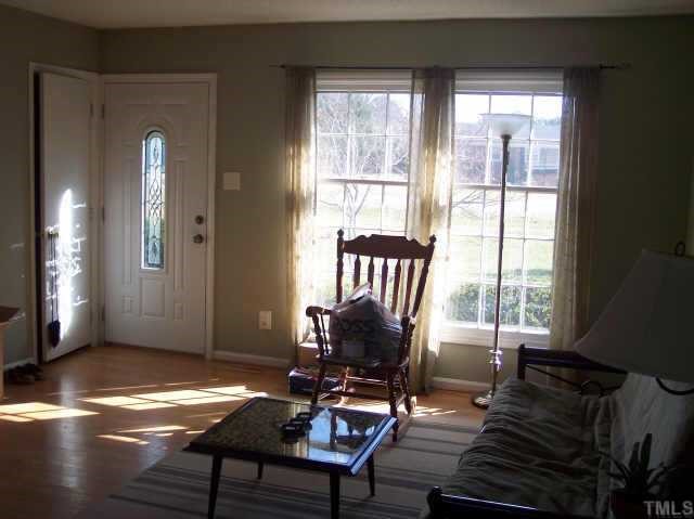 1109 Ridge Haven Drive Wendell, NC 27591 - Photo 2 of 5 a workspace with wooden floor and a window