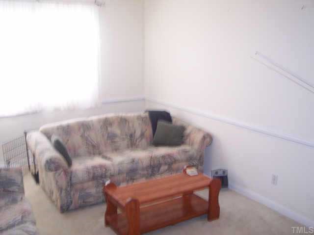 1109 Ridge Haven Drive Wendell, NC 27591 - Photo 3 of 5 a living room with furniture and a couch