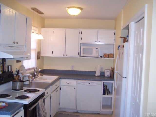 1109 Ridge Haven Drive Wendell, NC 27591 - Photo 5 of 5 a kitchen with a sink stove and cabinets