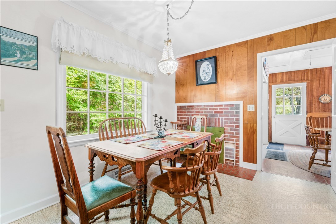 1794 Highway 105 Boone, NC 28607 - Photo 22 of 29 a view of a dining room with furniture window and outside view