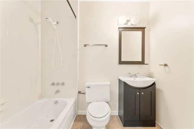 a bathroom with a toilet a sink and a bathtub