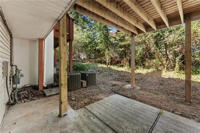a view of a porch with furniture and front door