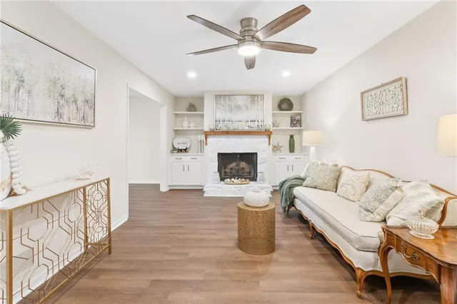 a living room with furniture and a fireplace