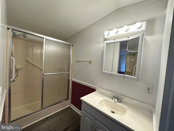 a bathroom with a sink and mirror