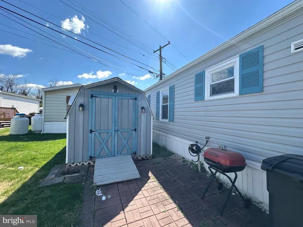 a view of a porch with furniture and a yard