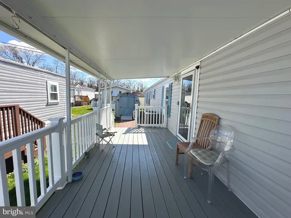 a view of outdoor space with deck and furniture