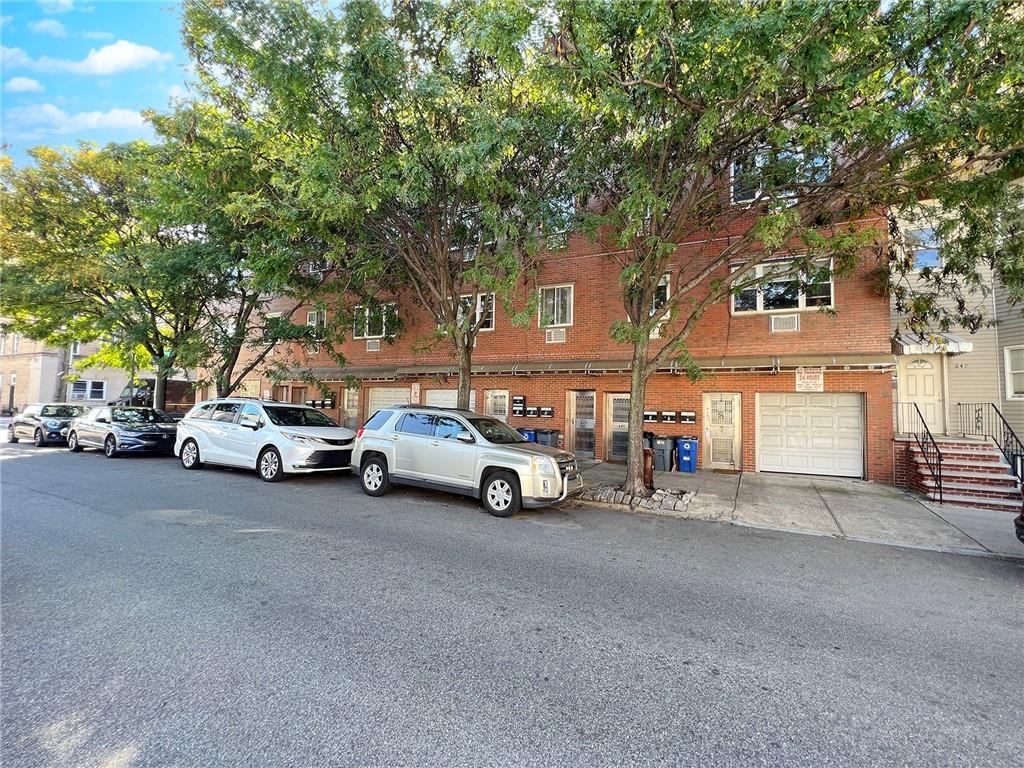 a view of a cars parked in front of a house
