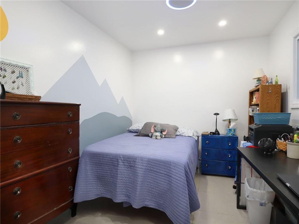 643 Morgan Avenue Brooklyn, NY 11222 - Photo 14 of 50 a bedroom with a bed and a dresser