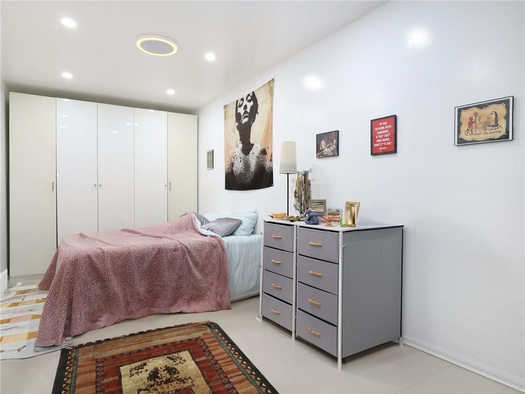 643 Morgan Avenue Brooklyn, NY 11222 - Photo 15 of 50 a bedroom with a bed and a dresser