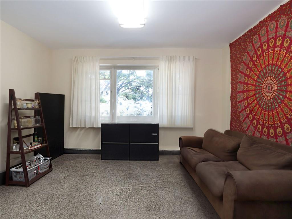 643 Morgan Avenue Brooklyn, NY 11222 - Photo 23 of 50 a living room with furniture a window and a flat screen tv